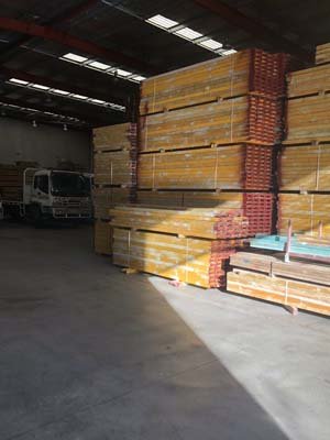 lumber and truck in warehouse
