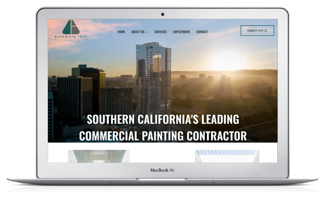 A laptop is open to a website for southern california 's leading commercial painting contractor.