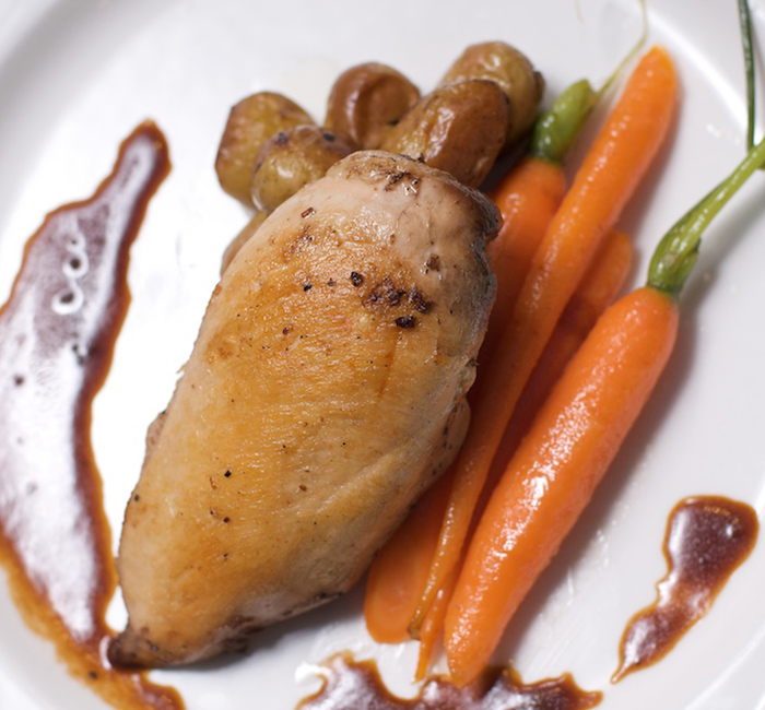 a white plate topped with chicken carrots and potatoes