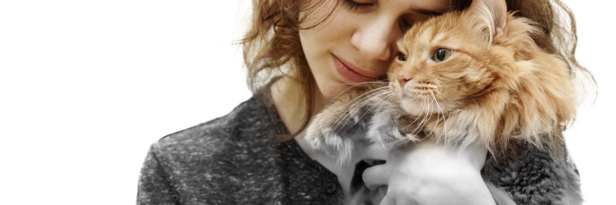 woman hugging her cat