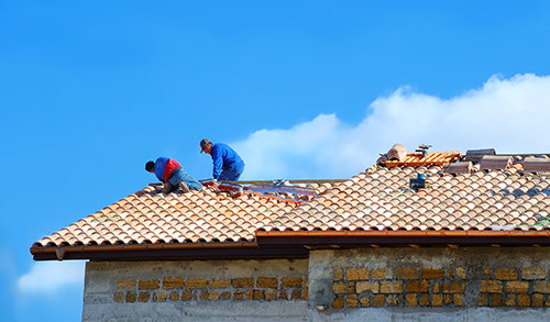 Qualified professional working on the roof installation