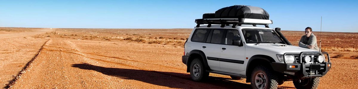 ep four wd accessories man standing near the jeep on the road