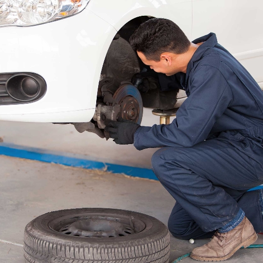 Our mechanic fixing a brake part in New South Wales 