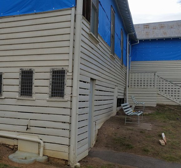 side of commercial building being repaired