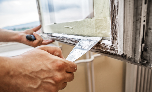 Professional repairing window's wooden frame