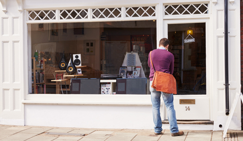 Custom entering a shop with large window