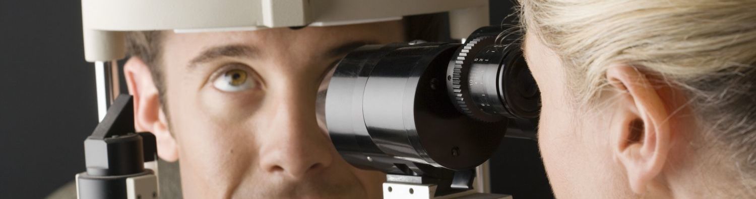 Man's eyes getting tested for contact lenses in Hokitika