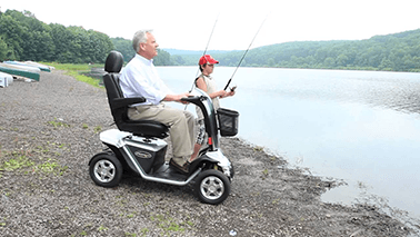 Man and child fishing with scooter