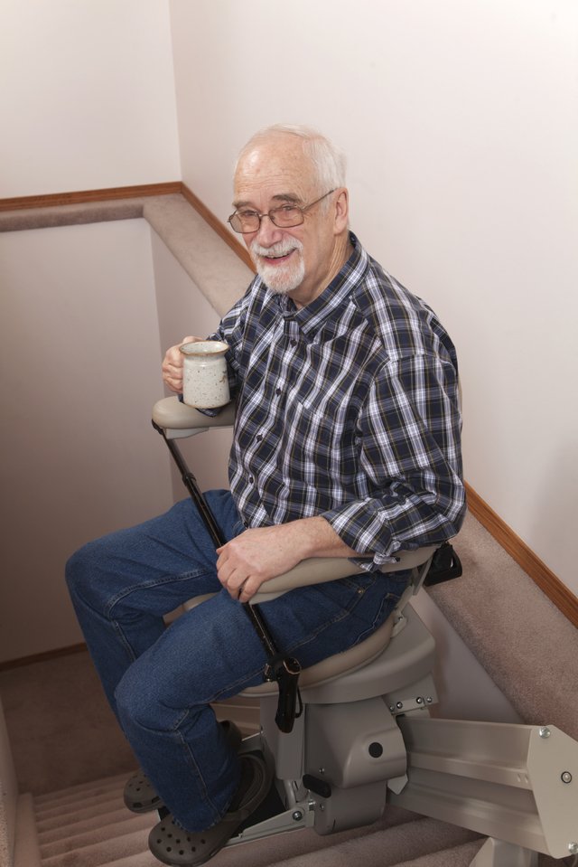 Old man in elevator chair