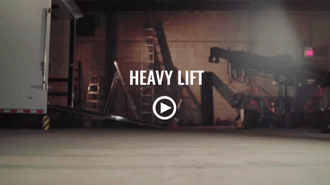 A video of a heavy lift in a garage.