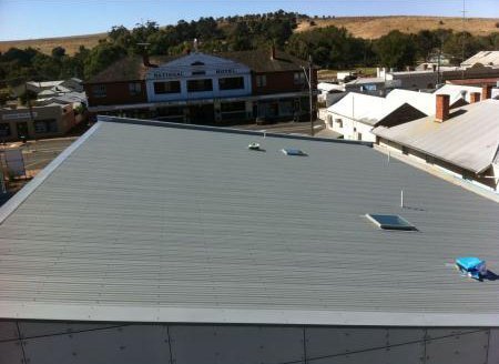 dark gray metallic roofing with small windows