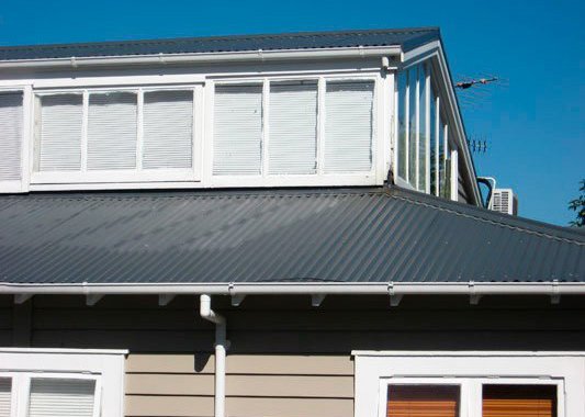shiny metal roof and white outlined windows