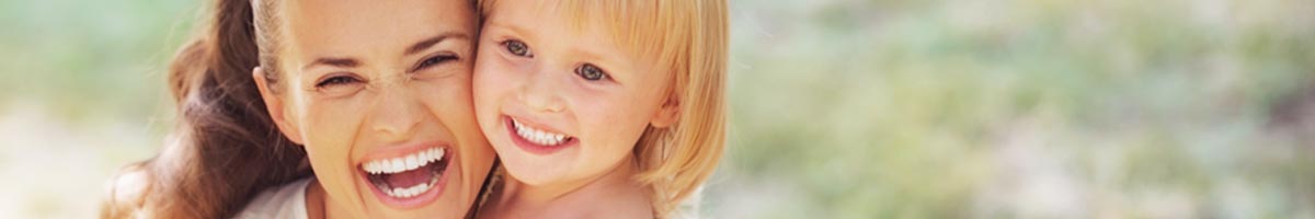 smiling mother and daughter