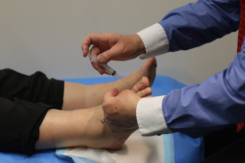 podiatrist working on feet