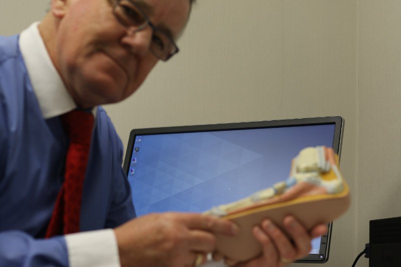 podiatrist working on feet