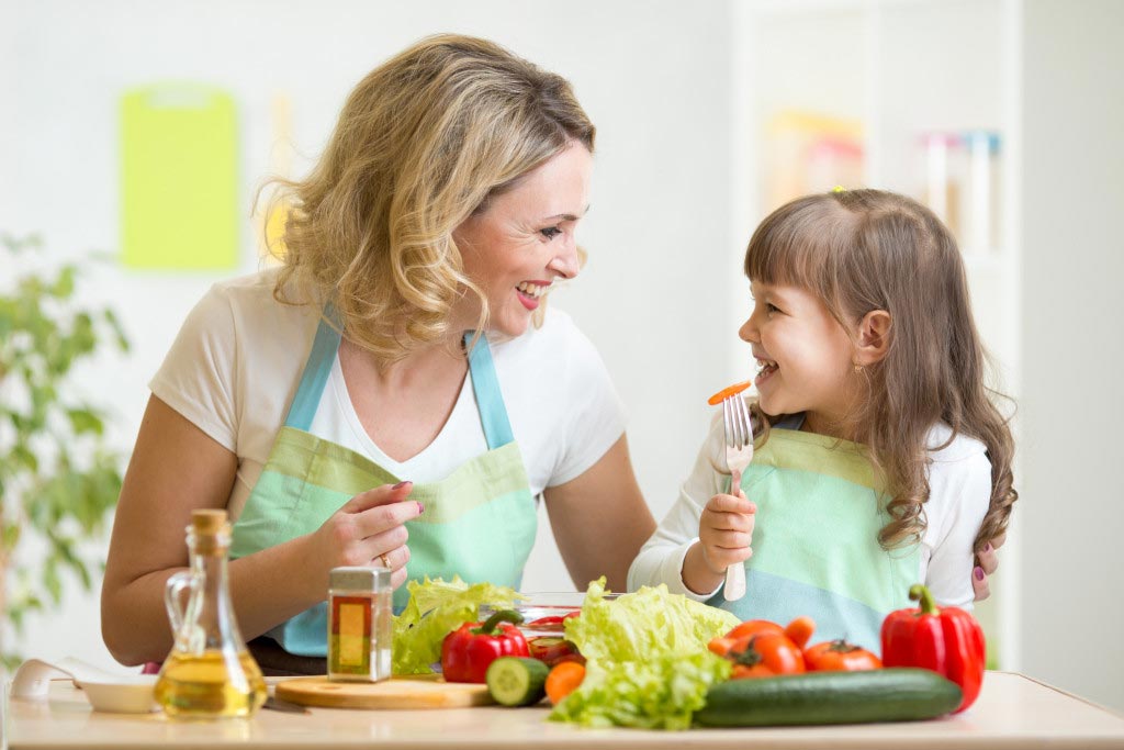 mother and daughter making a healthy meal