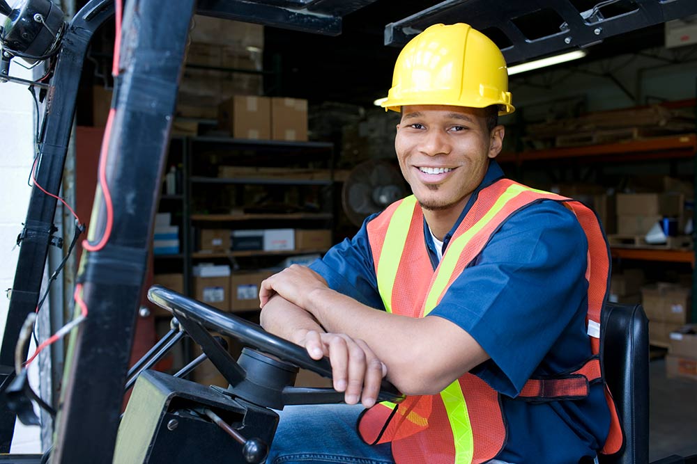 worker with vest and hard hat