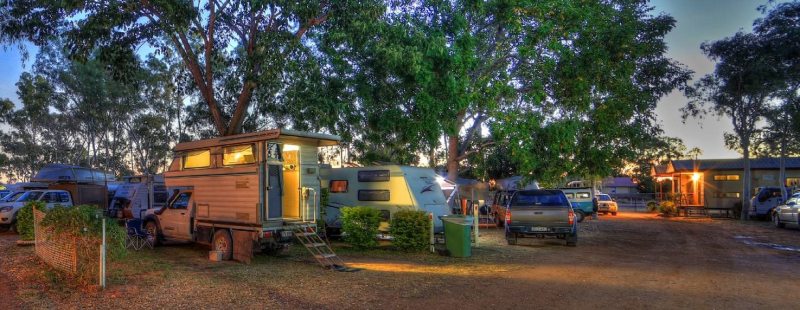 View of cars parked next to the houses at night