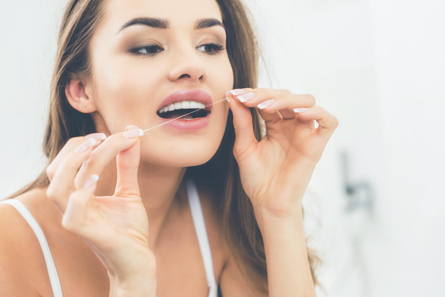 Flossing technique Family Dentist Houston TX Crown Dental