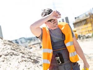 Laying_turf_in_winter_worker-sweating