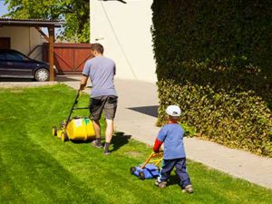 Mowing_your_lawn_landscape_father_and_son_mowing