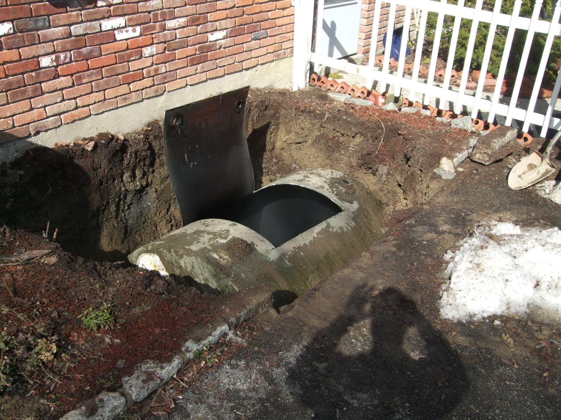 Open underground oil tank
