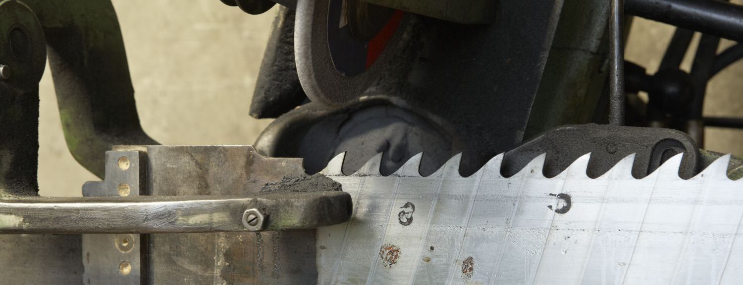 A saw being sharpened as part of sharpening services in the Taranaki Region