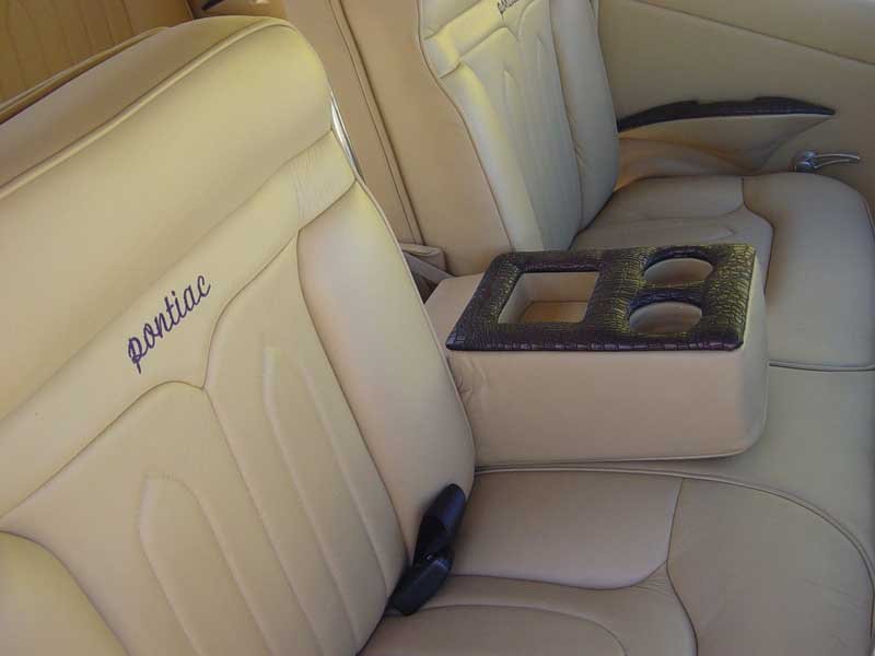 tan leather seating with embroidery