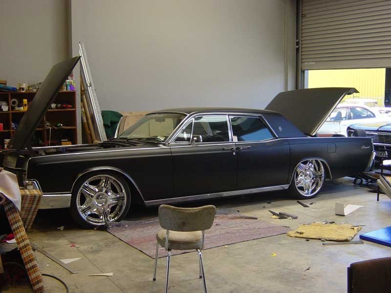 vintage classic black Lincoln sedan in shop