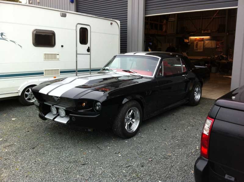 old style car with black stripes