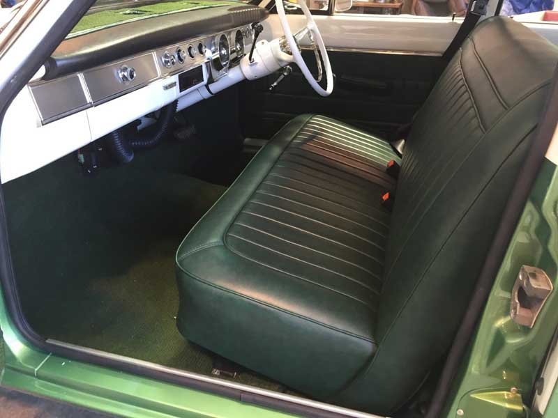 forest green bench seating in custom car