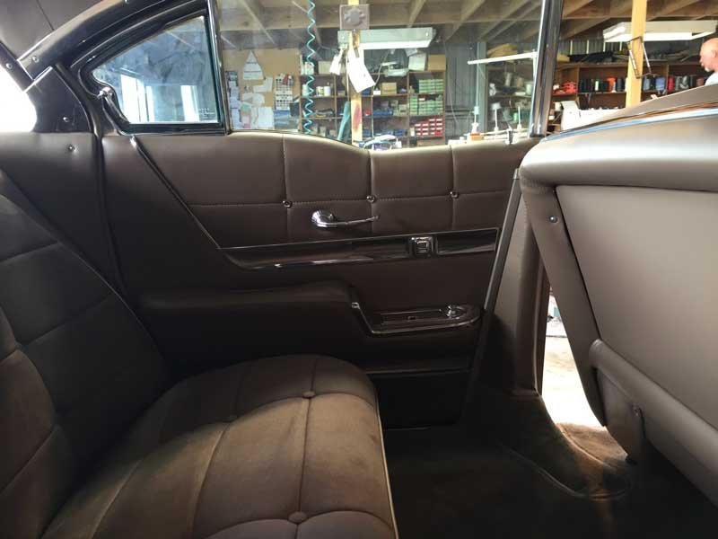 tan upholstery rear bench seating in custom sedan