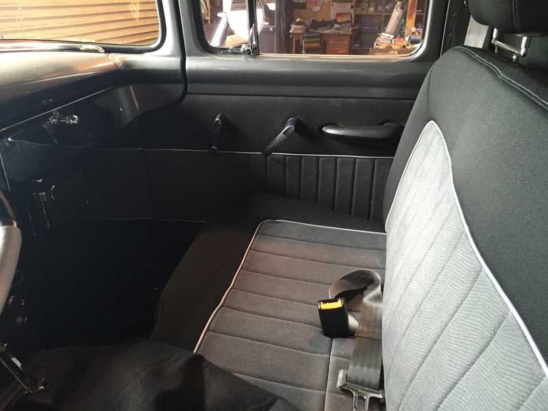 gray and black bench seating in vintage pickup