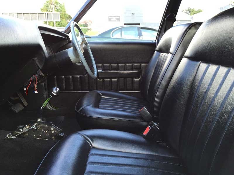 black leather drivers area in muscle car