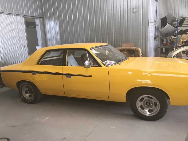 yellow american muscle car