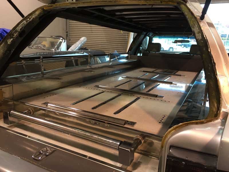 before interior of silver hearse upholstery