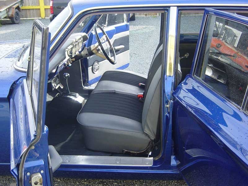gray leather bench seat in ford sedan