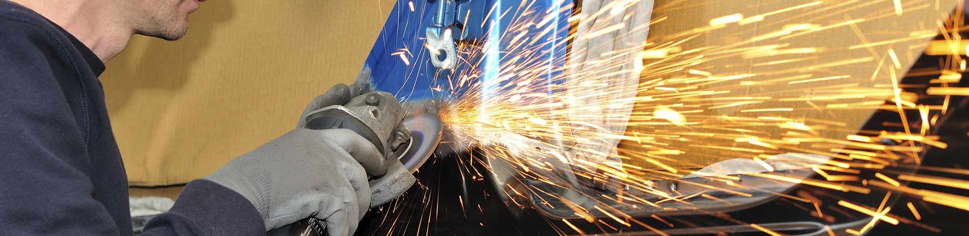 car-body-worker-repairing-car