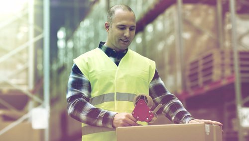 Worker packing cartons