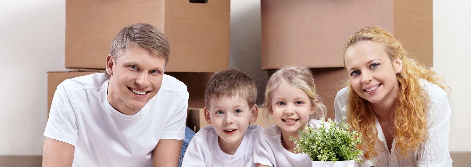 Happy family in their new Hamilton home after help from our removals team