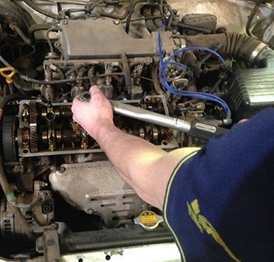mechanic working on engine