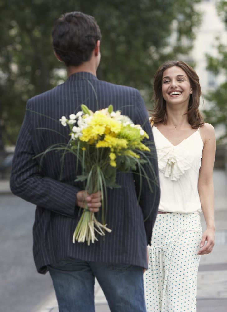Couple with an example of our flower design in Christchurch
