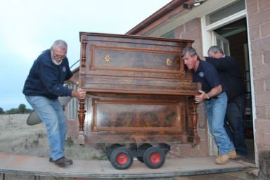 movers moving piano