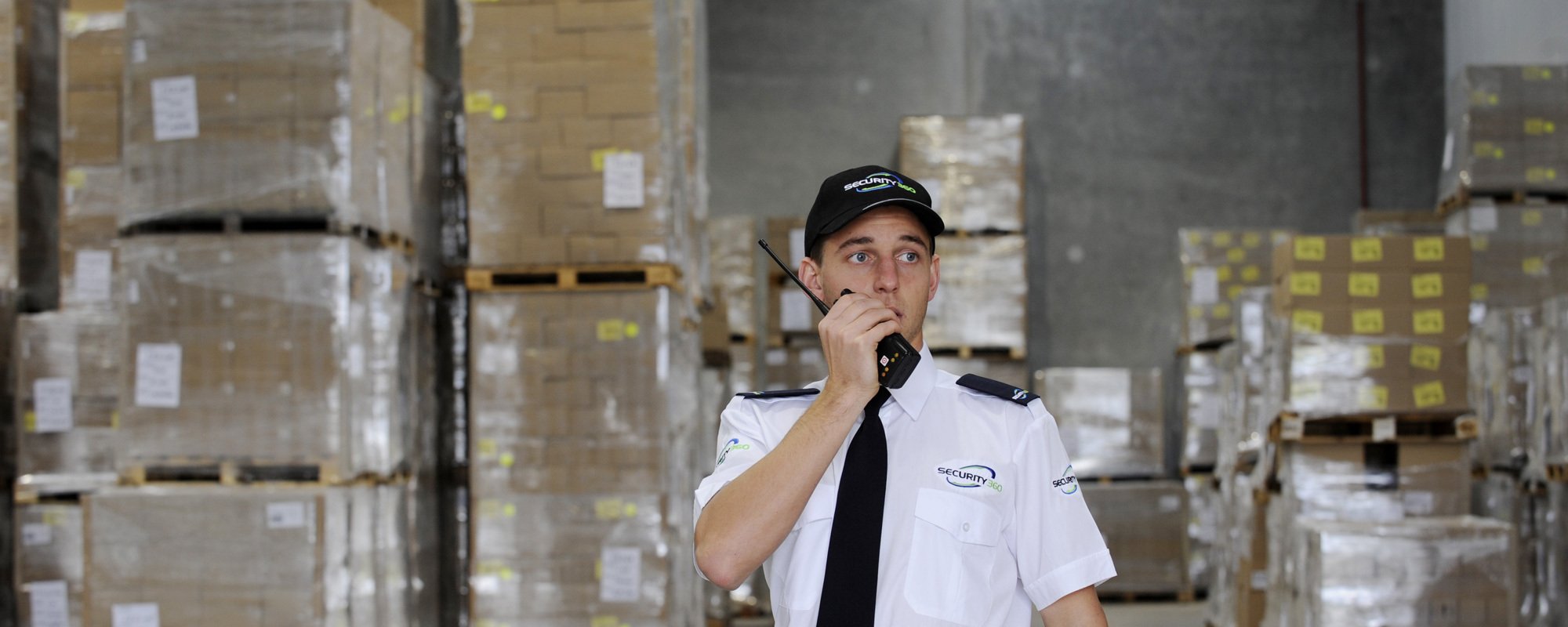 Security professional talking to other security on walkie talkie 