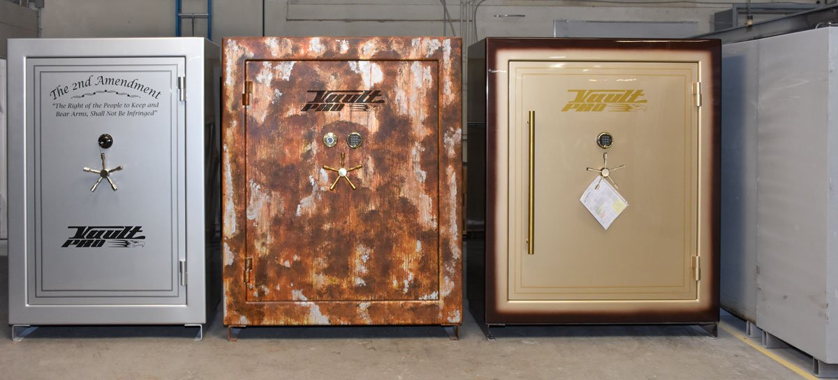 Three custom safes are sitting next to each other in a room. Made by Vault Pro USA