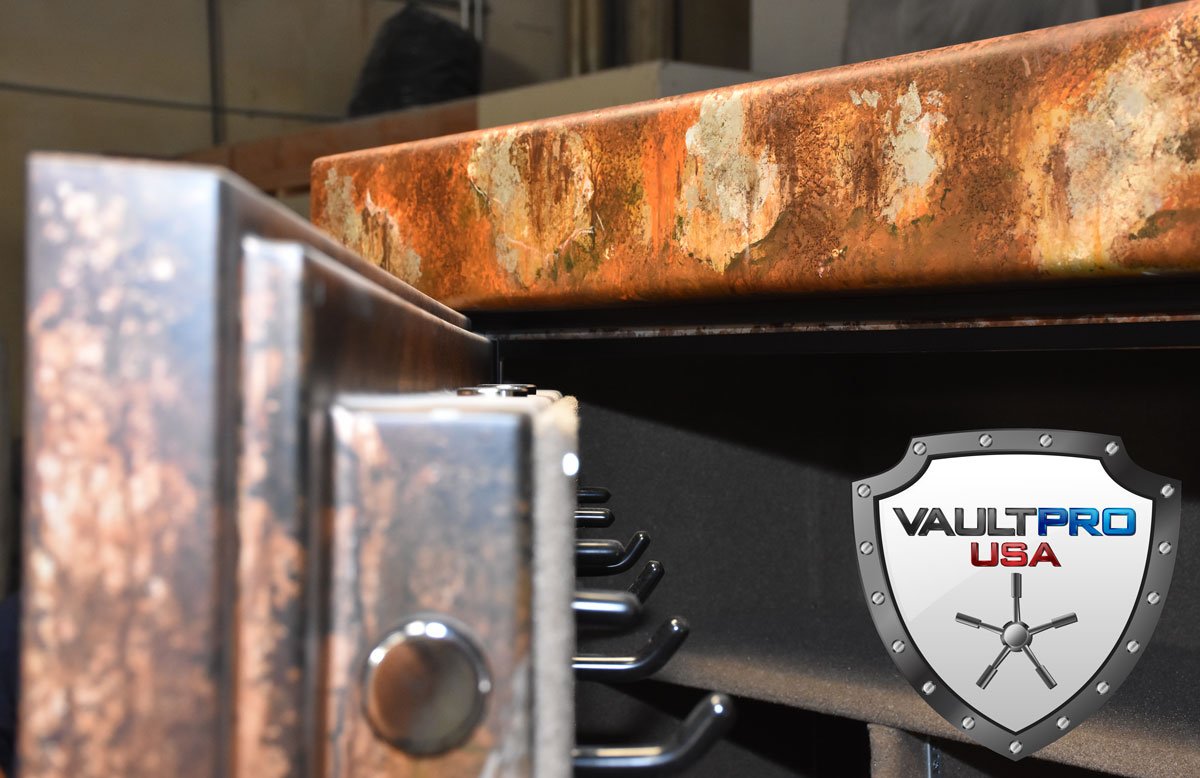 A close up of a vault pro USA safe with rusty paint finish