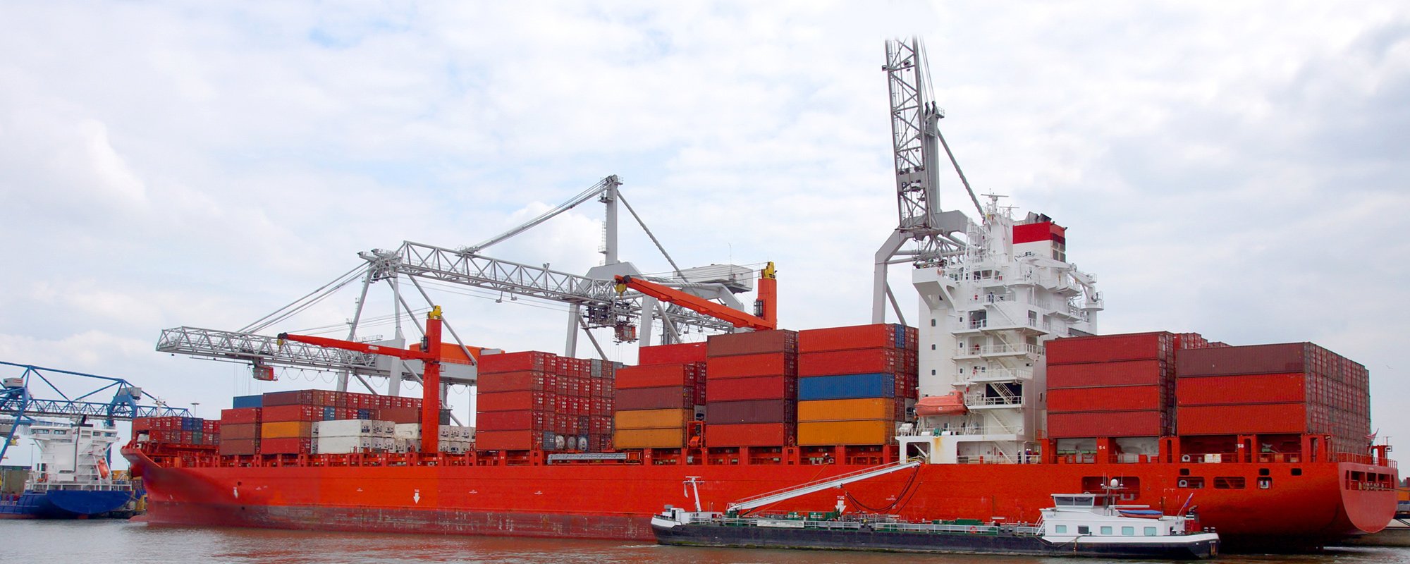 Cargo ship being loaded with containers
