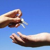 Professional handing over the keys to the customer