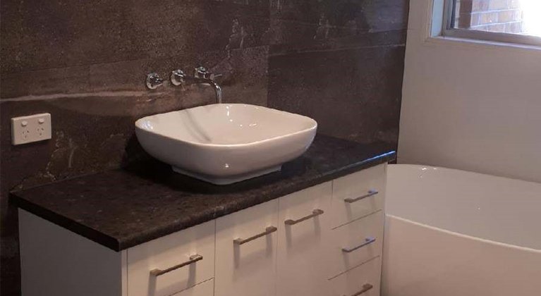 bathroom with granite vanity